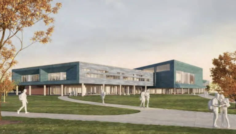 Architectural rendering of a modern educational building with a sleek, angular design featuring blue-toned exterior walls and large windows. The building is surrounded by green lawns and walking paths, with several white, stylized human figures